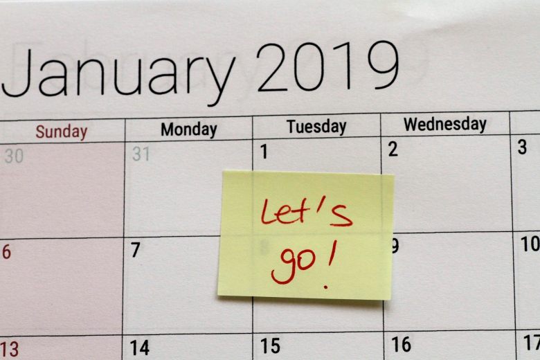 January calendar page with 'Let's go!' sticky note on the first of the month